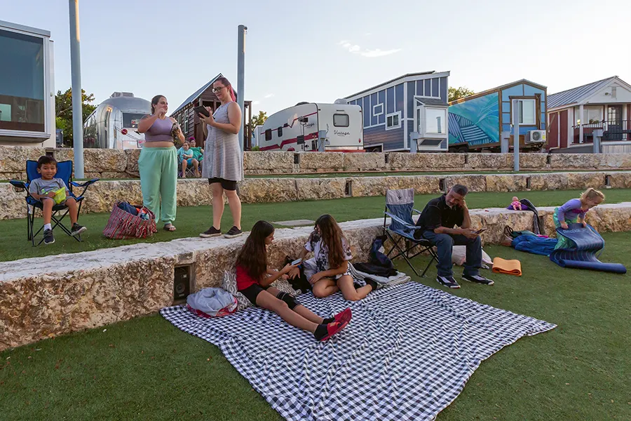 guests at community cinema watching movie in amphitheatre at Community First! Village